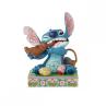 Figura enesco diseny stitch comiendo conejo de chocolate con huevos